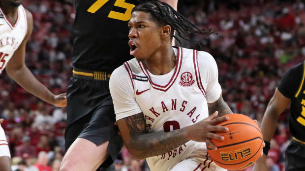 Razorbacks' guard Khalif Battle drives against Missouri